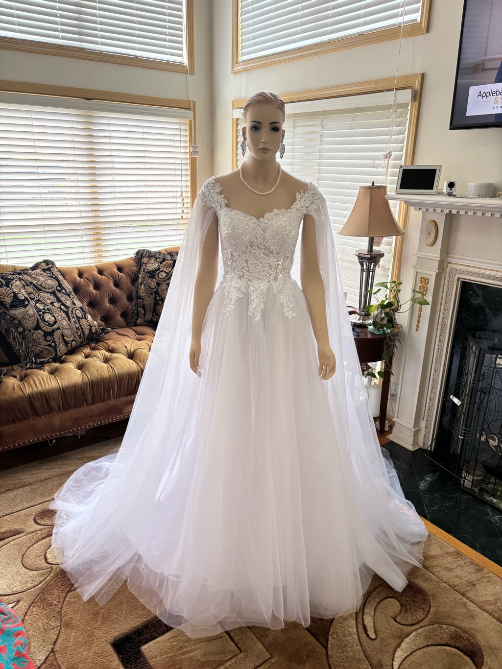 Elegant White Lace Applique Wedding Gown With Cape Sleeves With Corset Back.
